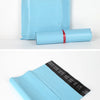 A light blue reusable waterproof poly shipping bag and a rolled-up version of the same bag.