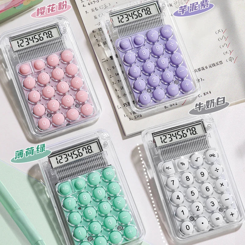 A collection of cute mini silent calculators in various colors and designs, including pink, purple, and white.