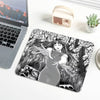 A mouse pad featuring a black and white illustration of a woman with long hair and outstretched hands.
