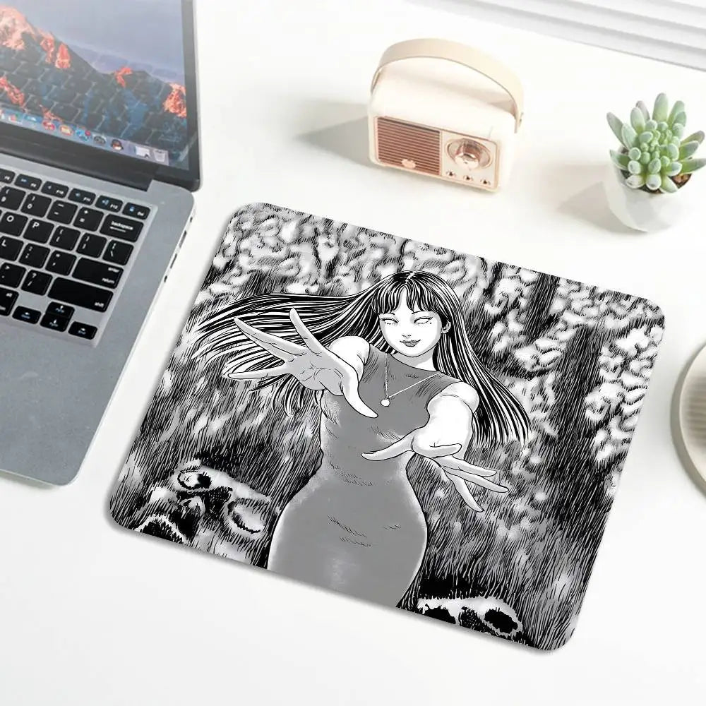 A mouse pad featuring a black and white illustration of a woman with long hair and outstretched hands.