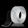 Roll of clear extra strong double-sided nano tape shown on a reflective surface.