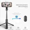 A black selfie stick tripod with a fill light and wireless remote control for taking photos.