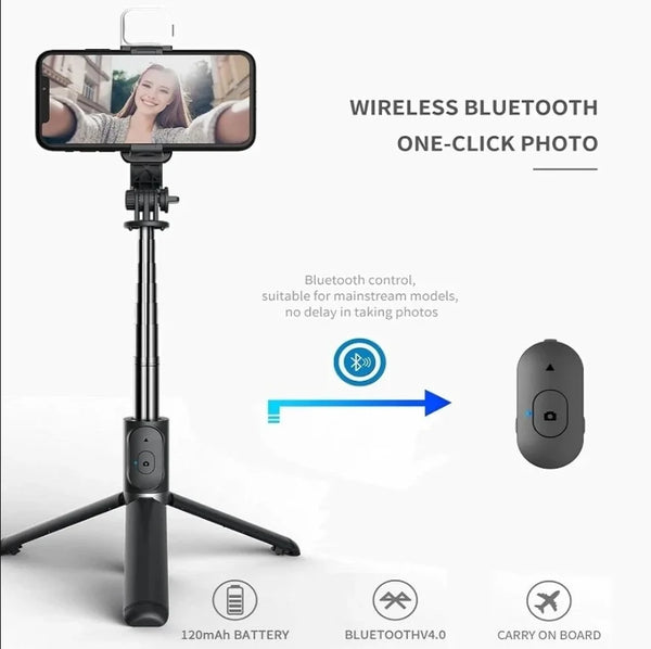 A black selfie stick tripod with a fill light and wireless remote control for taking photos.