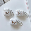 Three clear silicone TPU cases decorated with a brown and black dachshund pattern resting on a white surface.