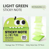 A box of light green sticky notes featuring a cartoon fruit design with large eyes and text indicating 80 sheets per box.