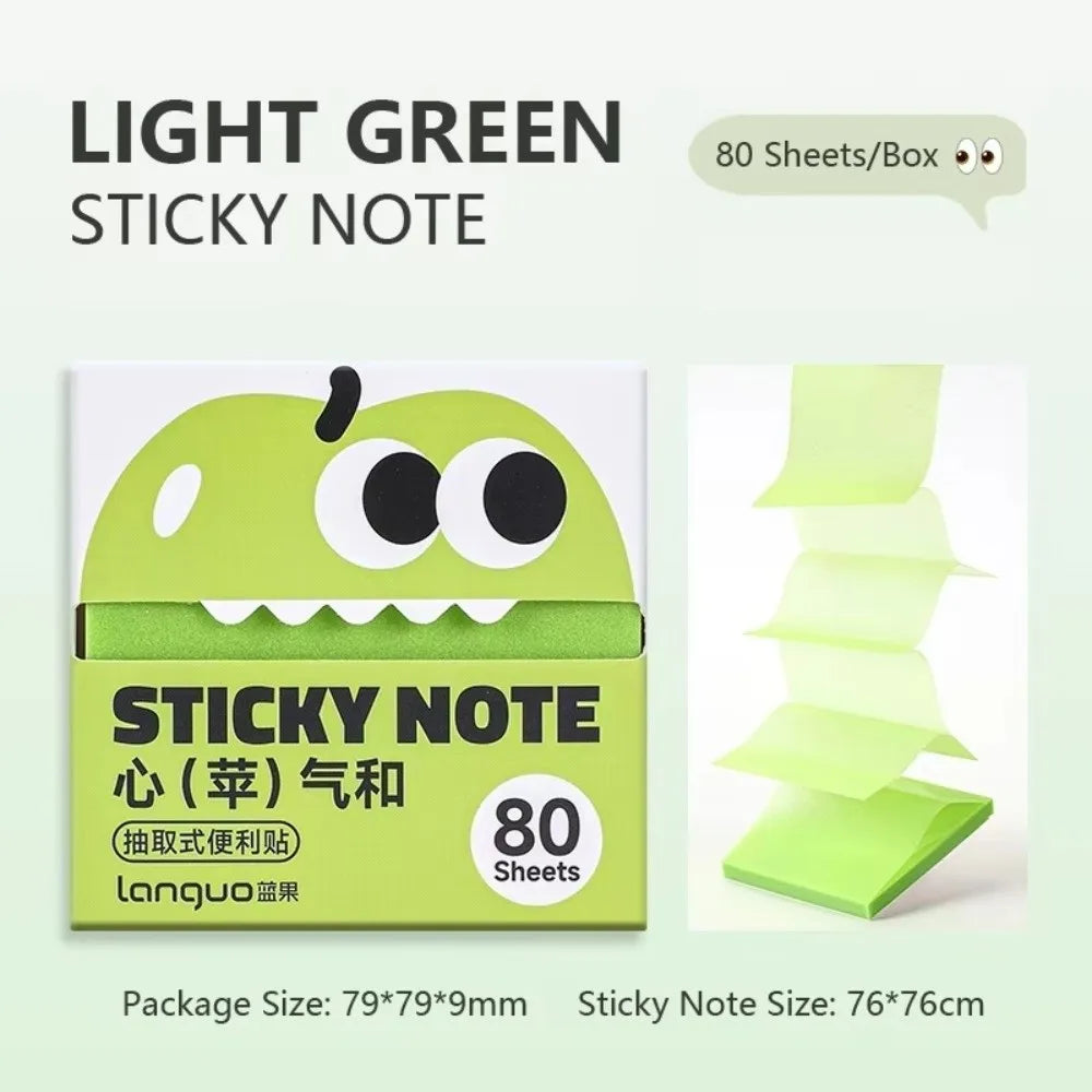 A box of light green sticky notes featuring a cartoon fruit design with large eyes and text indicating 80 sheets per box.