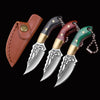 A compact fixed blade knife with a wooden handle and silver blade is shown with its leather sheath.