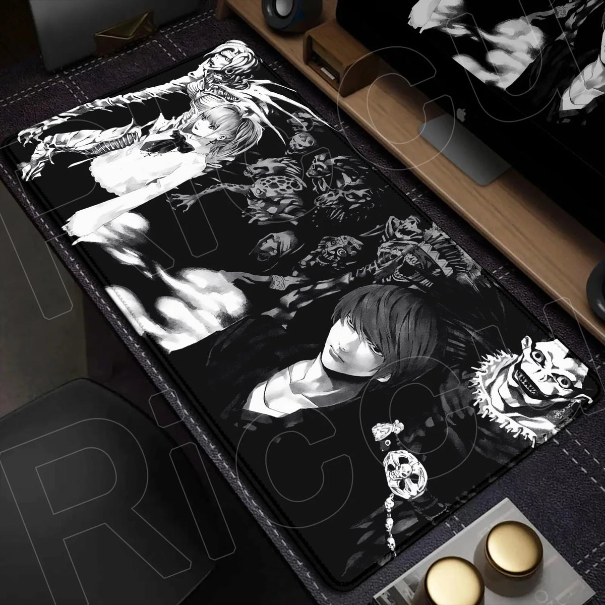 A black mouse pad featuring a monochrome illustration of a person with long hair and intense facial features.
