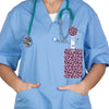 A person wearing light blue scrubs holds a leopard print retractable badge holder with a stethoscope attached.