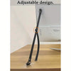 A black adjustable TV safety strap is shown attached to a wall, demonstrating its use for baby proofing furniture.