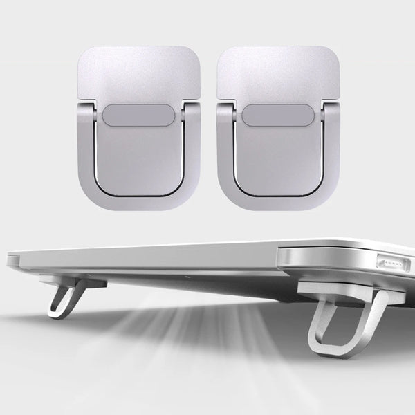 Two portable aluminum laptop stands shown in a light gray color, with one standing on a desk.