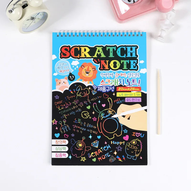 A pad of Scratch Note paper featuring colorful illustrations and text, next to a pink cosmetic item.