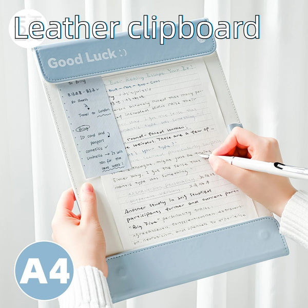 A blue leather clipboard with lined paper and a pen is shown, featuring contrast stitching.