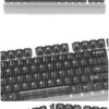 A close-up view of a black clear mechanical keyboard with various keycaps and switches.