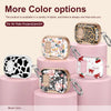 Varias opciones de color de fundas protectoras de silicona para AirPods Pro y Pro 2/3/4 mostradas en soportes rosas.