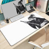 A white gaming mousepad featuring an illustration of Miyamoto Musashi from the Vagabond manga.