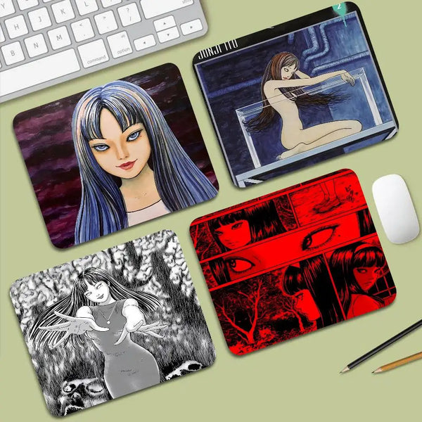 A collection of Junji Ito Tomie mouse pads featuring various illustrations and designs.