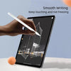 A hand is using a white precision stylus pen to write on a black tablet screen.