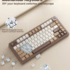 A close-up view of a hot-swappable mechanical keyboard showing various switches and keycaps for DIY customization.