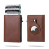 A brown leather wallet with a card pop-up feature and an Apple logo embossed on the cover.