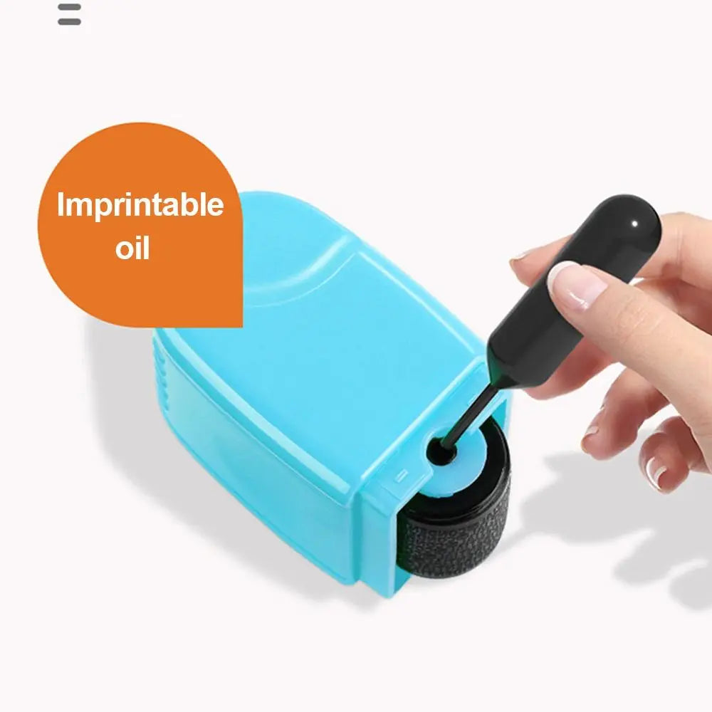A hand is applying imprintable oil from a blue roller stamp onto a surface.