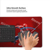 A hand is using a mouse on a red desk mat featuring a Spider-Man design.