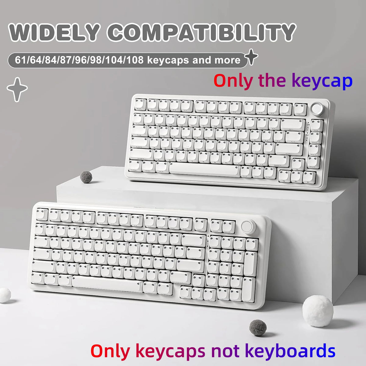 White mechanical keyboard keycaps displayed on a white box with loose keycaps.