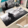 A black and white illustration of Miyamoto Musashi from Vagabond manga printed on an XXL gaming mousepad.