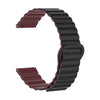 A close-up view of a dark maroon and black adjustable magnetic loop watch band.
