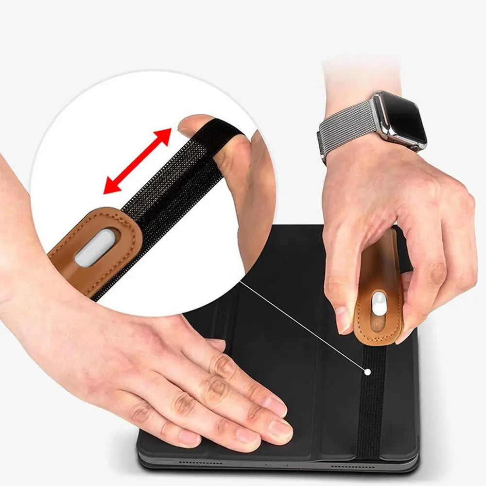 A hand holds a leather protective case for a tablet stylus pen, demonstrating its design.