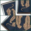 Vintage stainless steel card and cash case featuring a leopard print design on a dark blue background