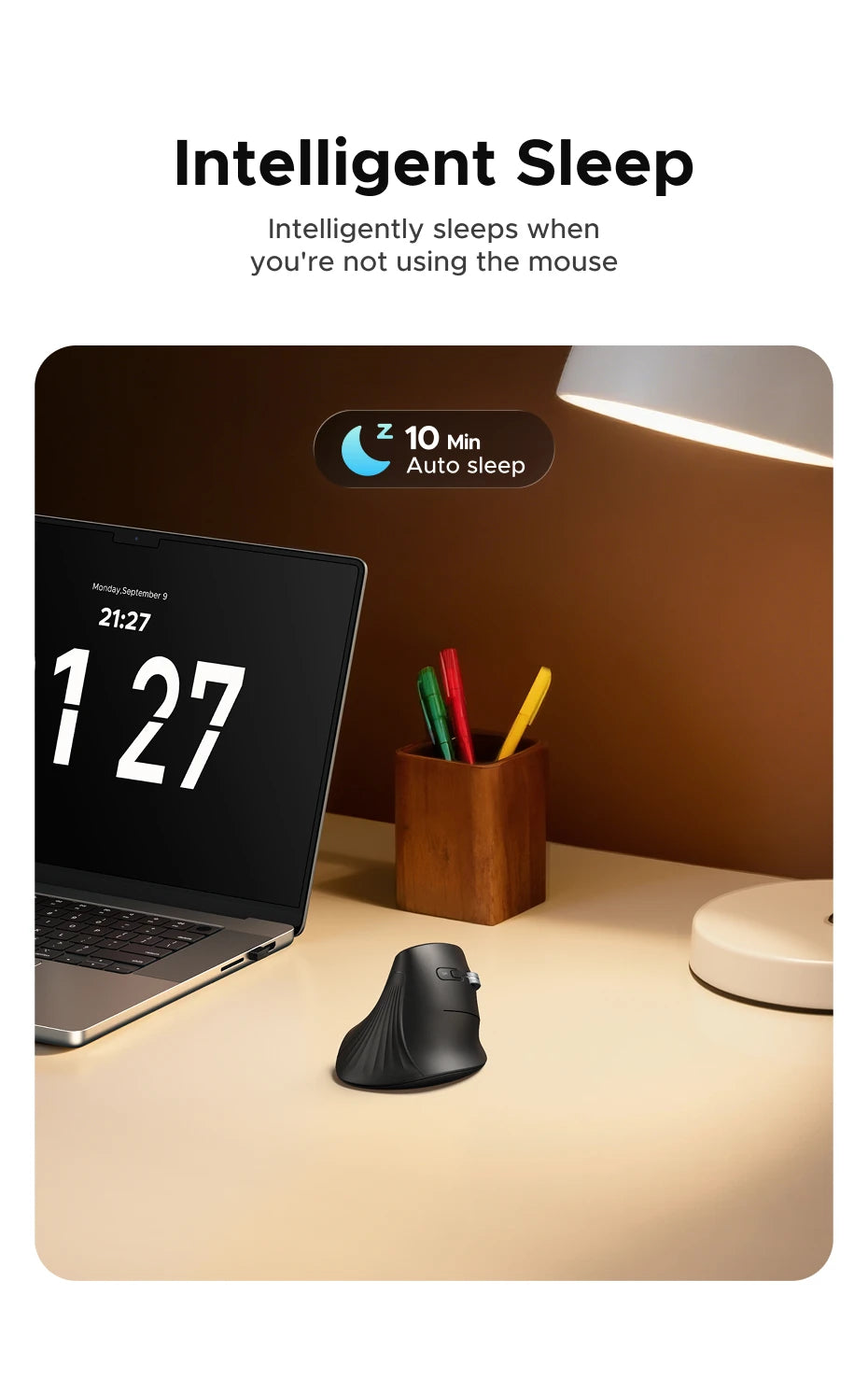 A black ergonomic vertical wireless mouse is shown next to a laptop, illustrating intelligent sleep features.