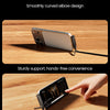 A close-up of a smartphone being charged using a smooth, curved elbow design cable.