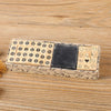 A rectangular wooden stamp seal set featuring alphabet letters and symbols in a light wood tone with a dark square stamp.