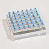 A tray of adjustable mechanical keyboard switches and keycaps with a puller set arranged in a grid.