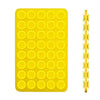 A yellow double-sided silicone phone mount grip with multiple circular holes.