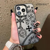 A hand holds a holographic gradient phone case for an iPhone featuring gothic and religious symbols.
