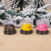 Three clear plastic packages containing metal service bells for coffee, beer, and hug.