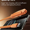 A close-up of a copper-colored fast charging cable with an integrated stand being used to charge a smartphone.