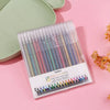 A clear plastic case filled with 18 colored glitter gel pens is displayed on a pink surface.
