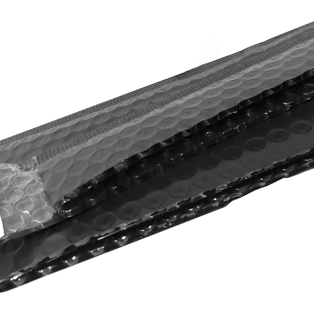 Black bubble mailers for secure shipping shown in a close-up view.