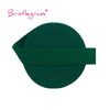 A dark green elastic hair tie or trim, coiled and laid flat.