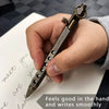 A hand holds a brass bolt-action ballpoint pen with a textured barrel, demonstrating smooth writing.