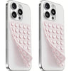 A white silicone suction cup phone mount with a pink double-sided grip shown from the back.