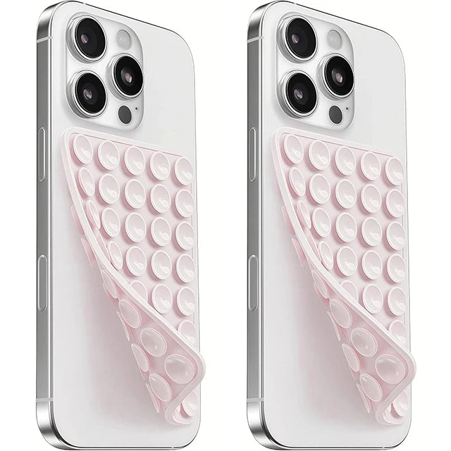 A white silicone suction cup phone mount with a pink double-sided grip shown from the back.