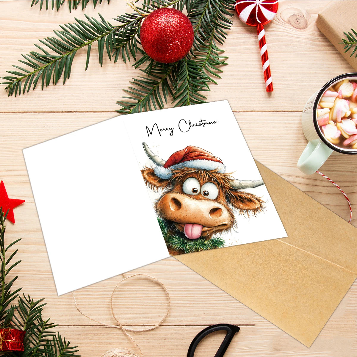 A greeting card featuring a cute Highland cow illustration with a festive Christmas theme, set against a wooden background.