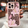 A pink leopard print phone case featuring large pink lily floral designs for an iPhone.