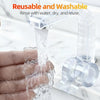 A hand is rinsing a clear reusable and washable silicone tape with water.
