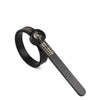 A black ring sizer and measuring tool with a magnifier attached to a strap.