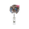 Funny hamster acrylic badge reel featuring a face with blue tears and a pink bow